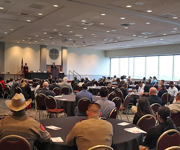 President Evans speaking at a criminal justice event presentation